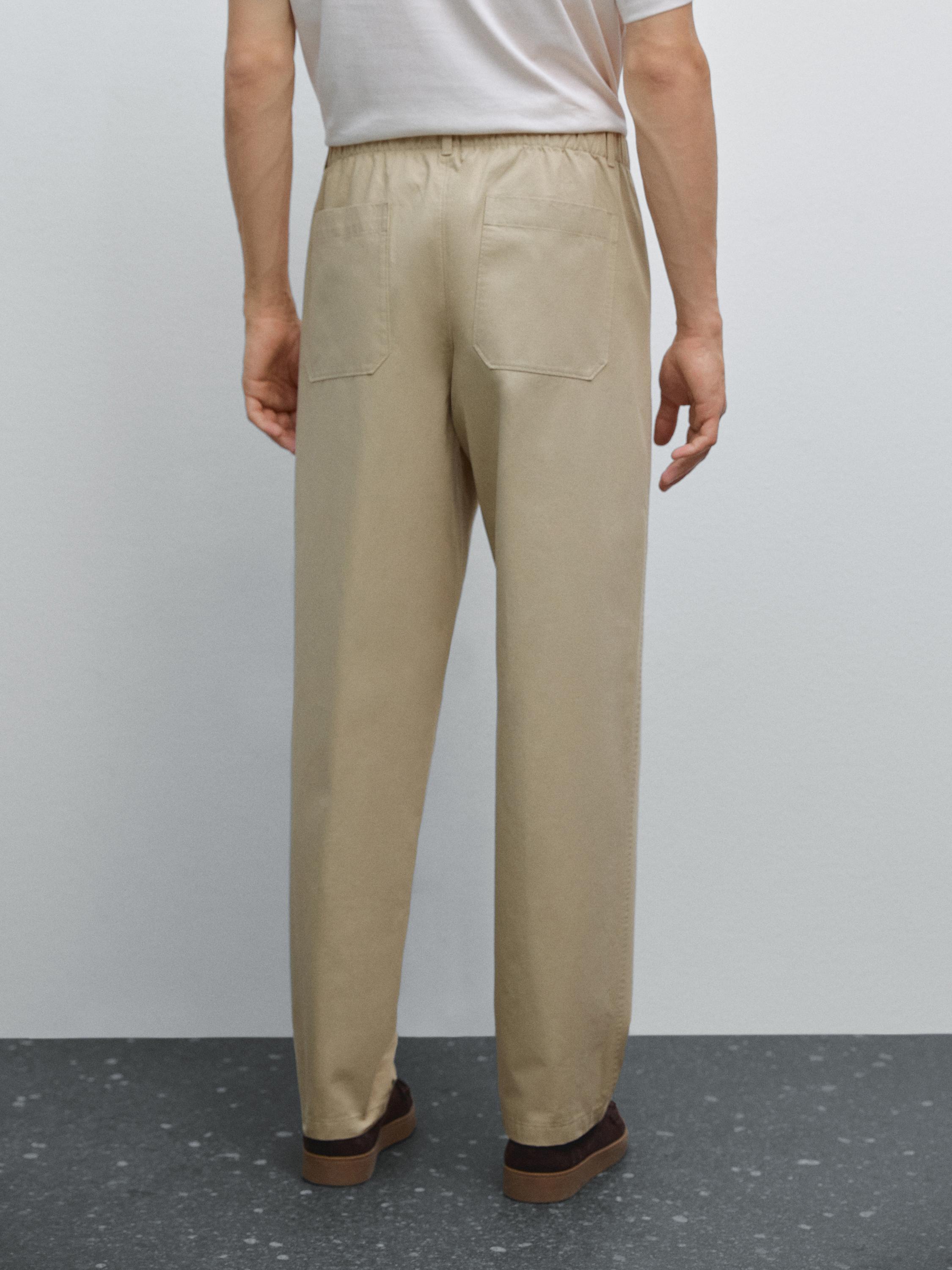 Trousers with patch pocket